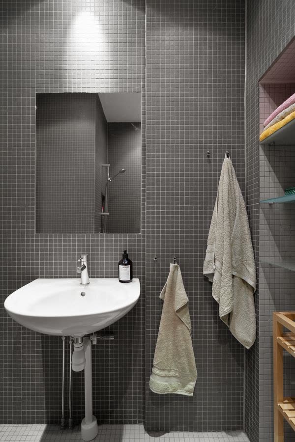 Tiled bathroom with a sink and towels