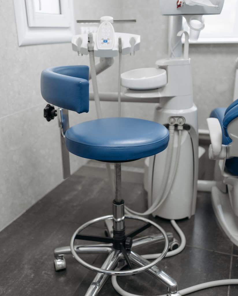 The hygienist stool beside the chair in treatment room three