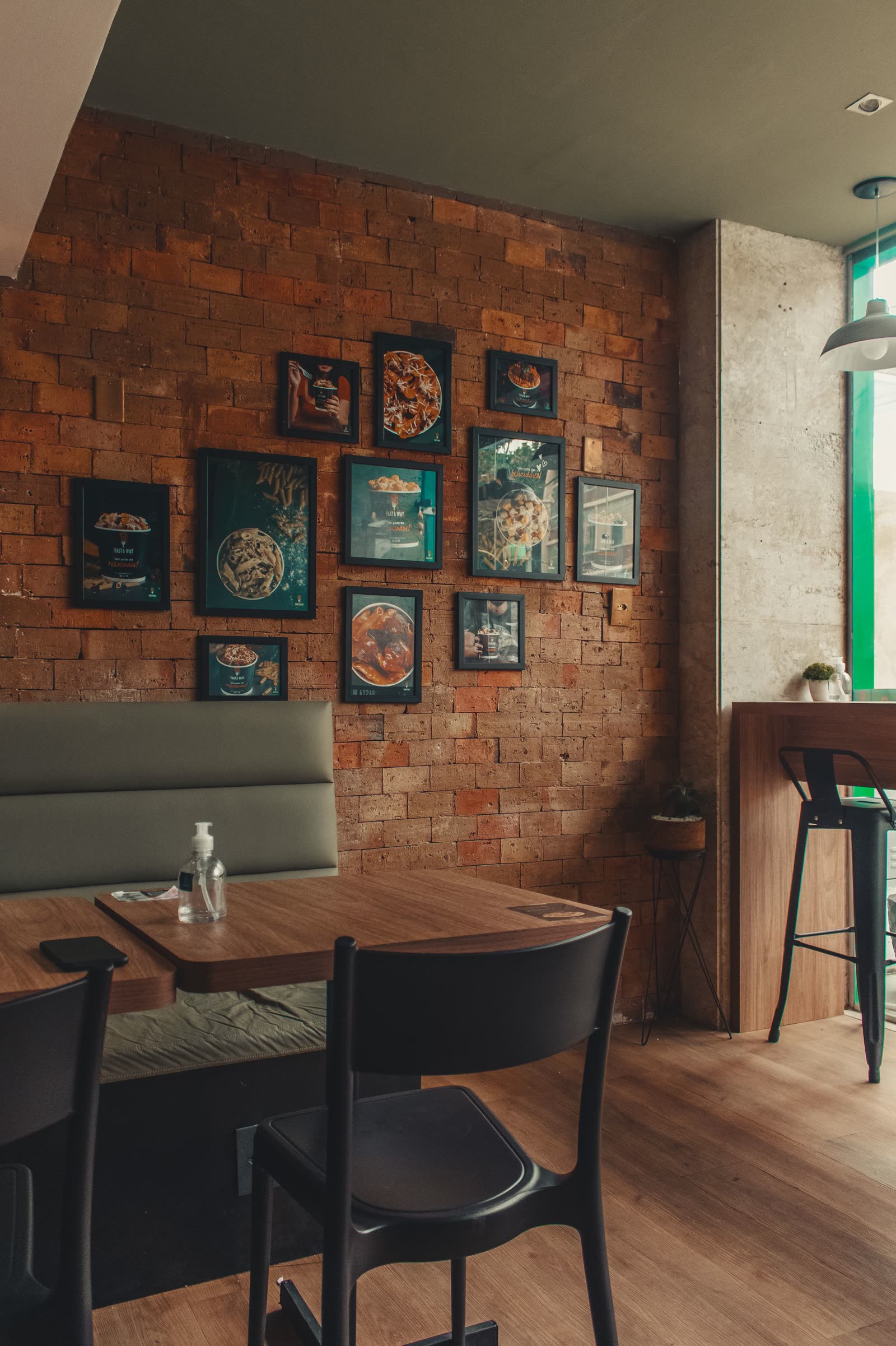 A corner of the COPPER LANTERN dining room, its walls hung with framed pictures