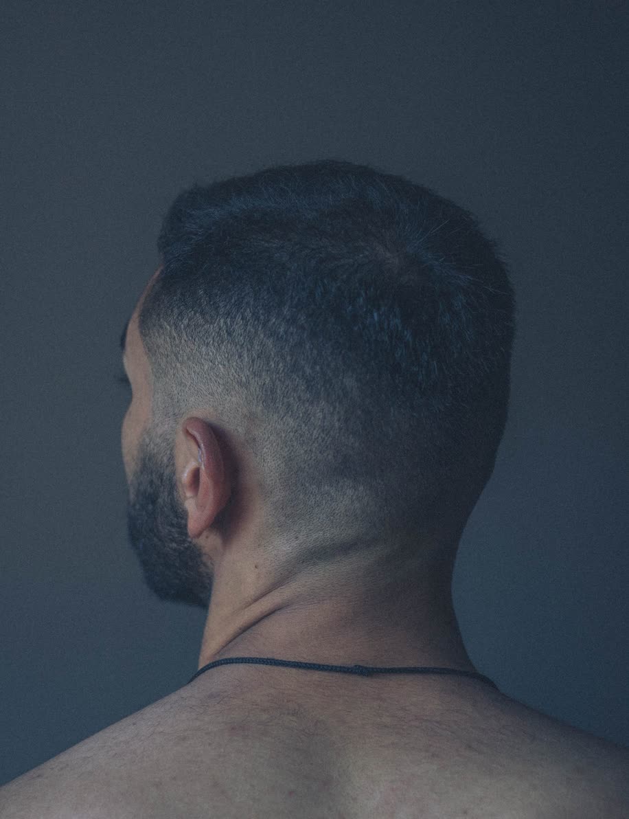 Short skin fade blended into a trimmed beard