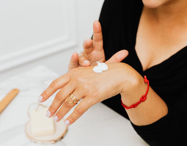 Lotion being spread along a forearm