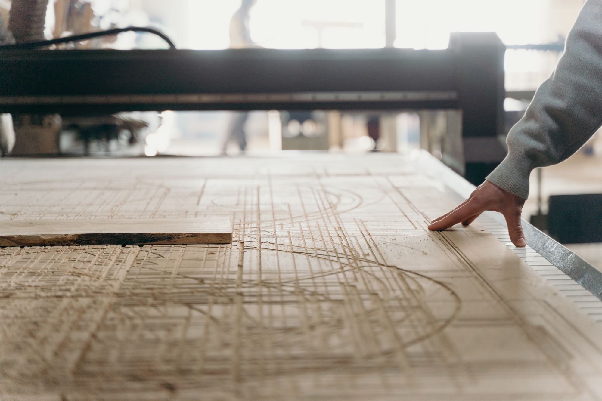 A CNC-routed relief panel on the router bed