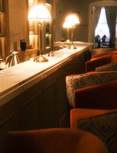 Brass lamps along the bar counter