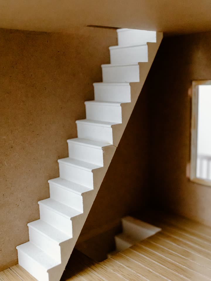 Chipboard model of a stair against a wall