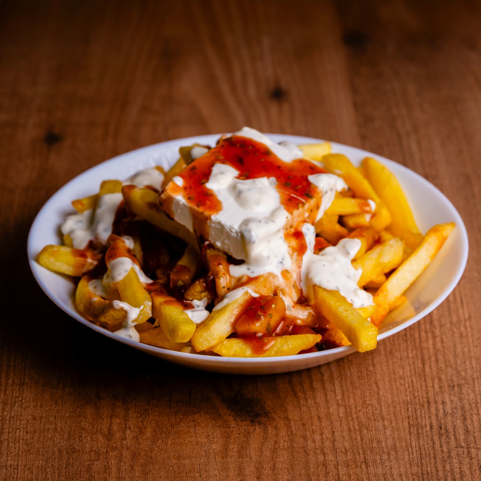 A bowl of frites with aioli