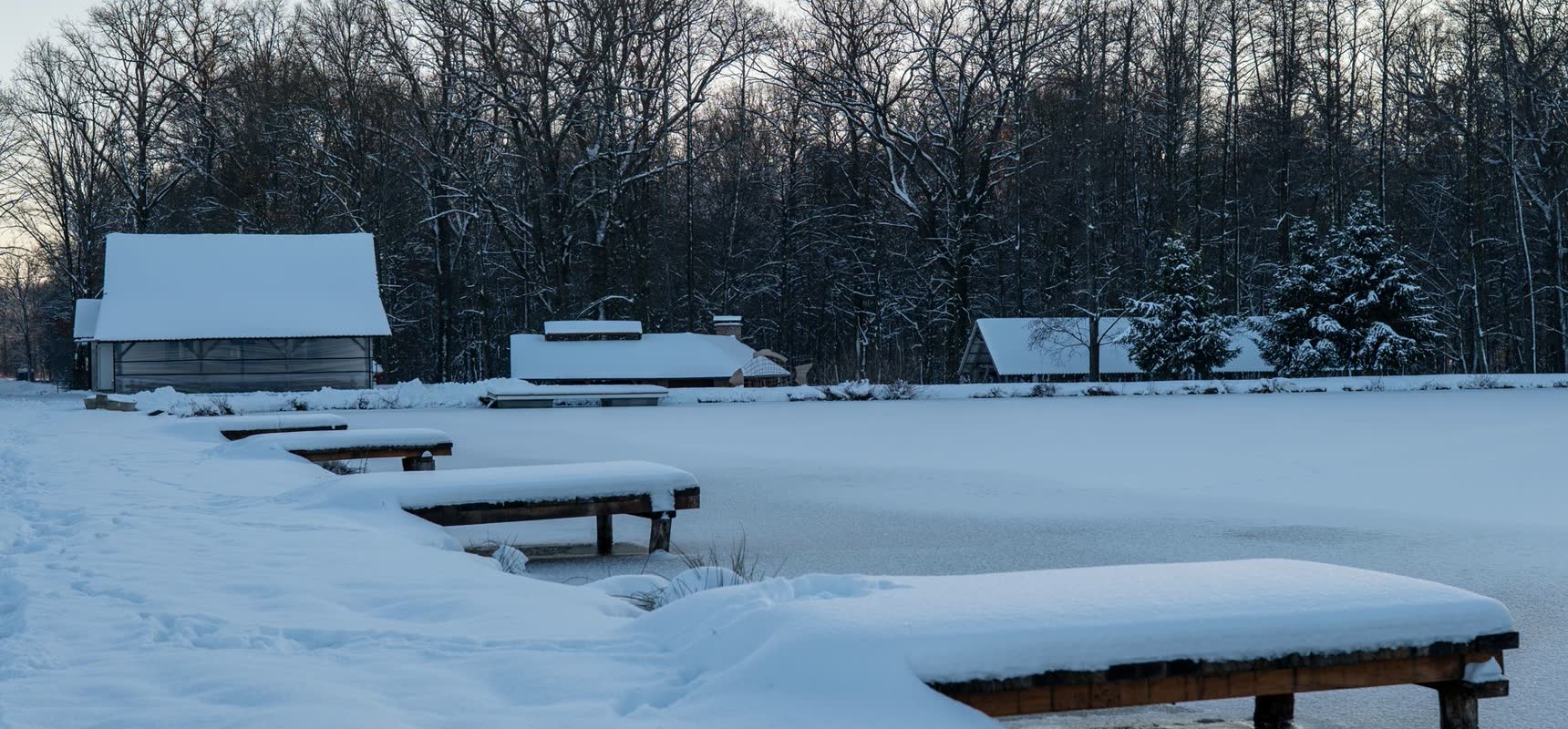 Frozen Lake Weekend — snow-covered docks on a frozen lake